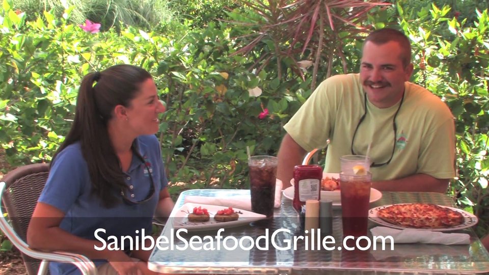 Casual seafood restaurant dining room with bar seating.